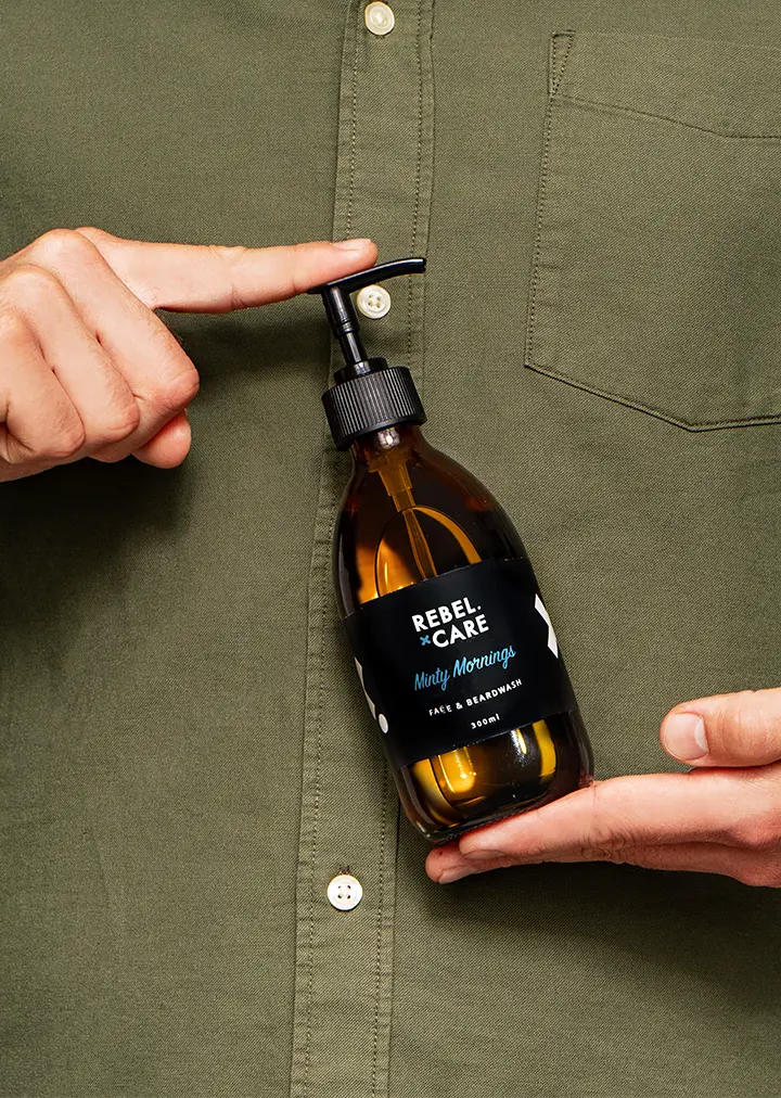 Man holding Rebel care Minty mornings face and beard wash refill